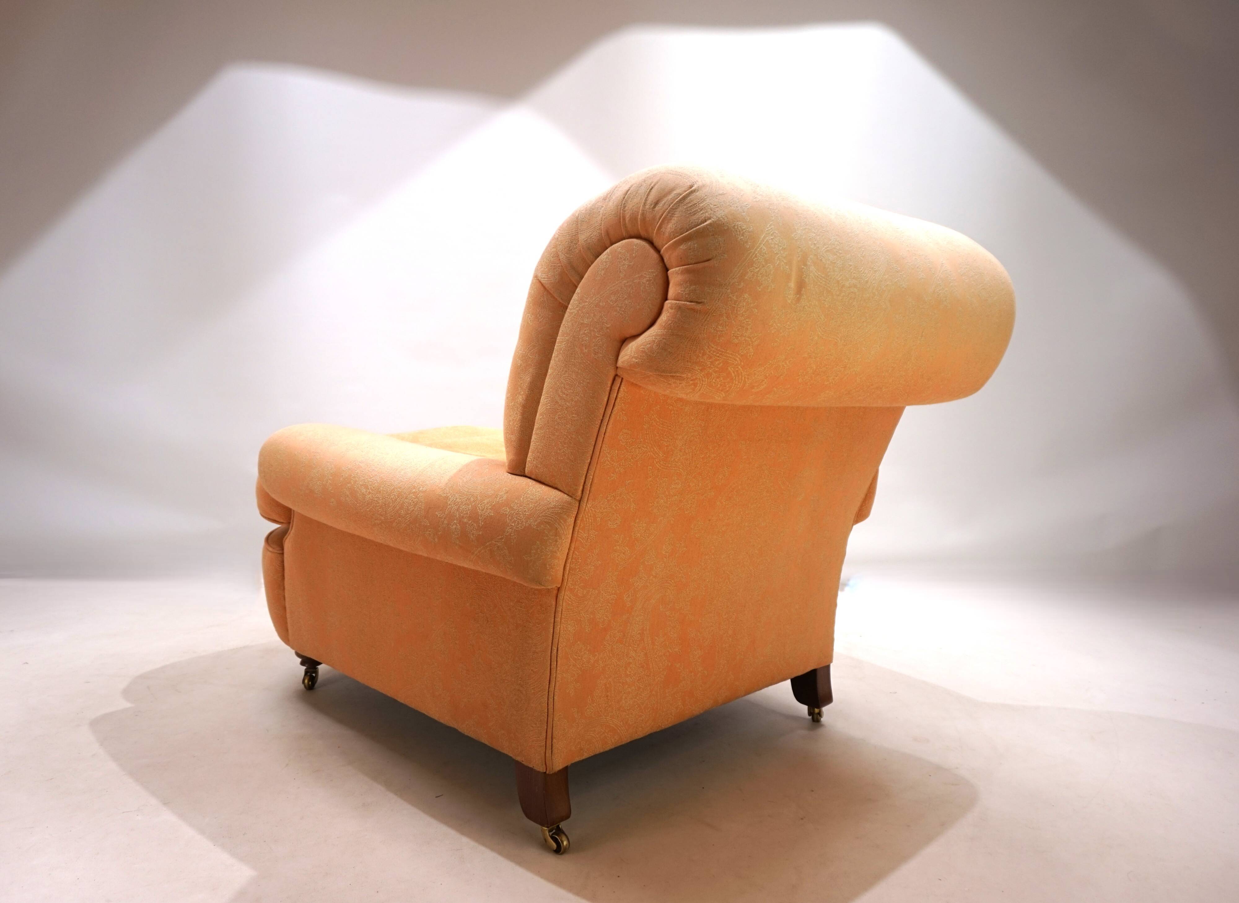 Deep seated armchair in the style of Howard & Sons