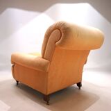 Deep seated armchair in the style of Howard & Sons