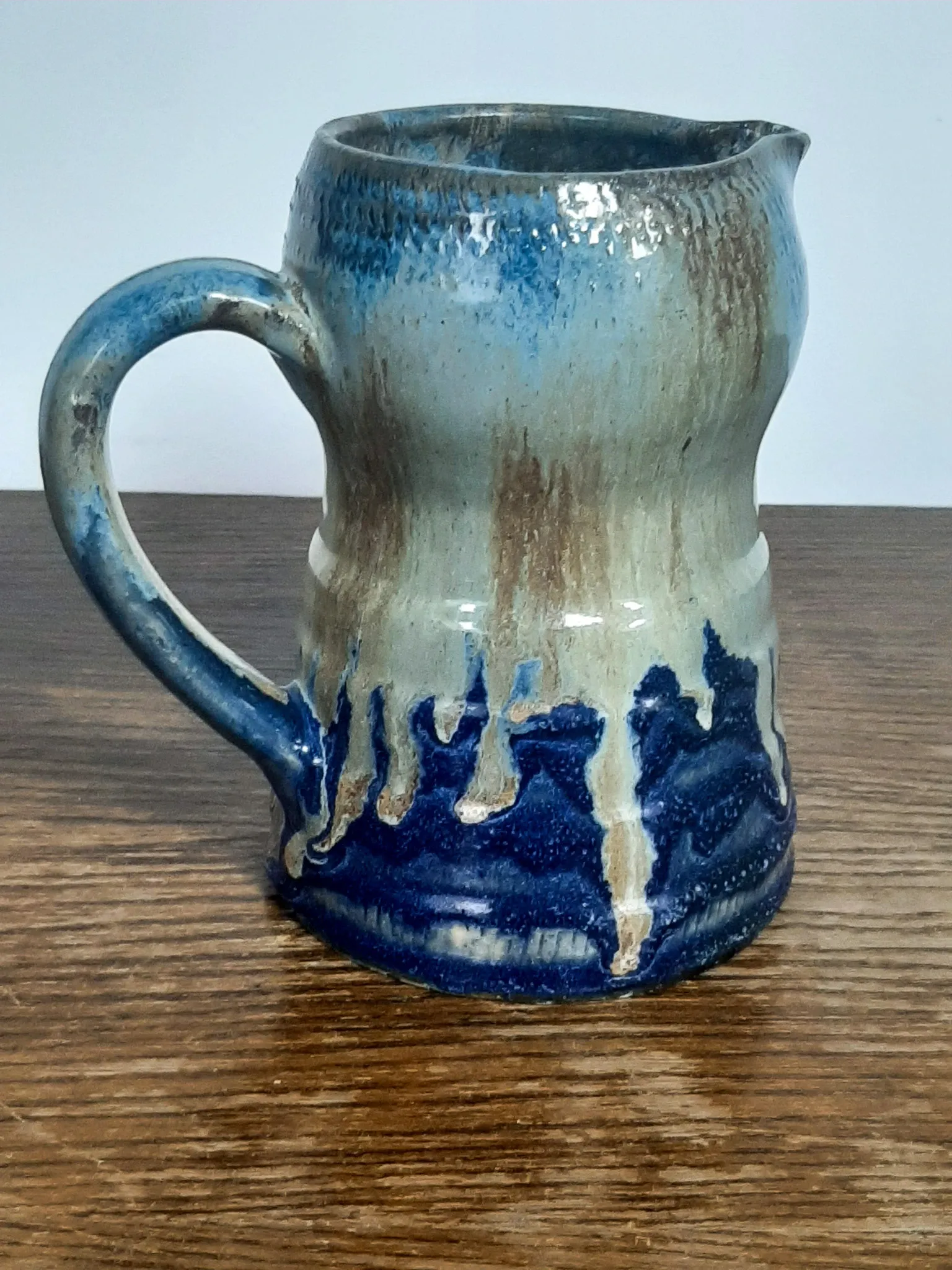 Blue flamed stoneware jug