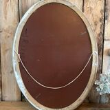 White patinated oval mirror