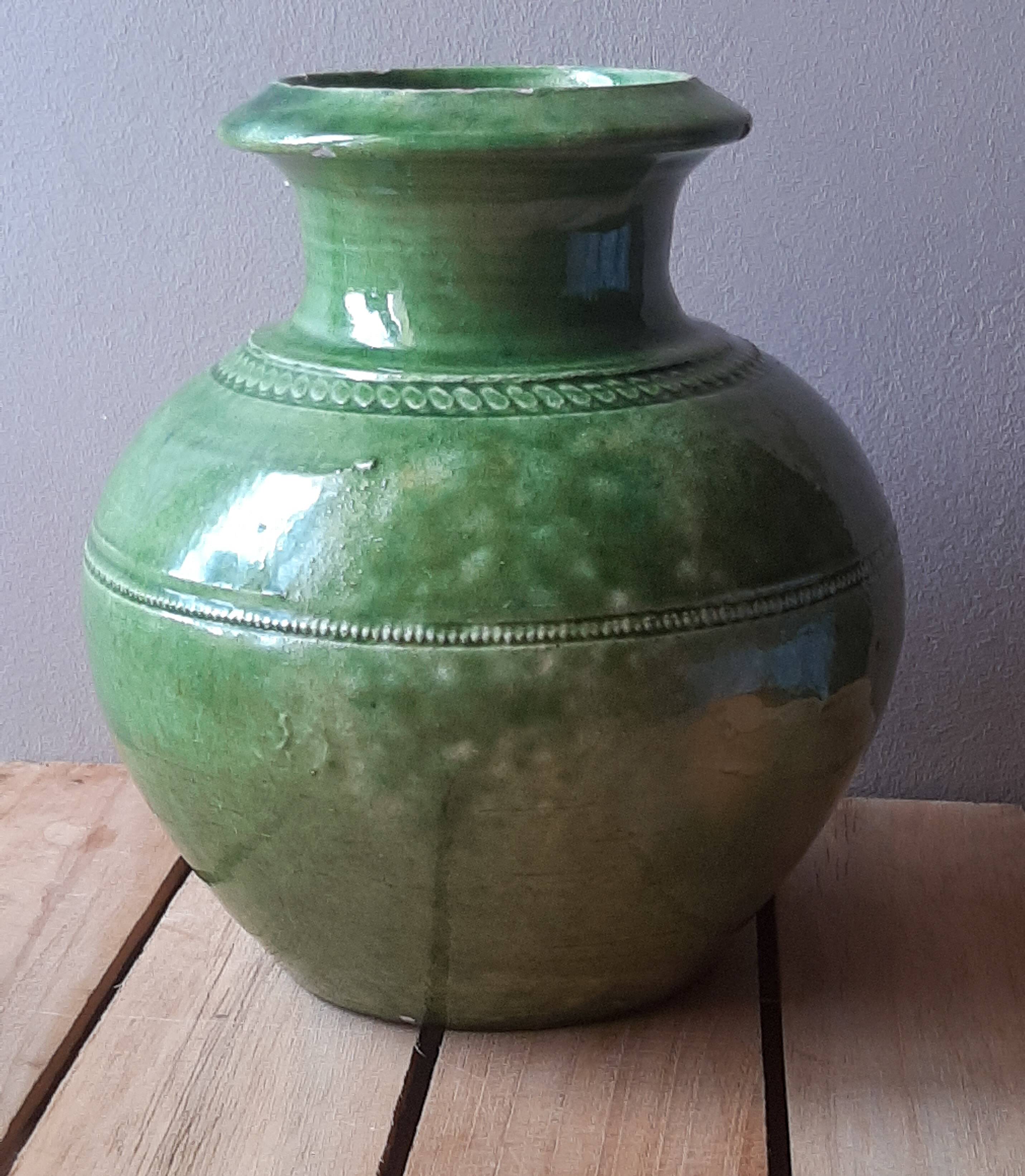 Ancient vase in glazed terracotta with green glaze.