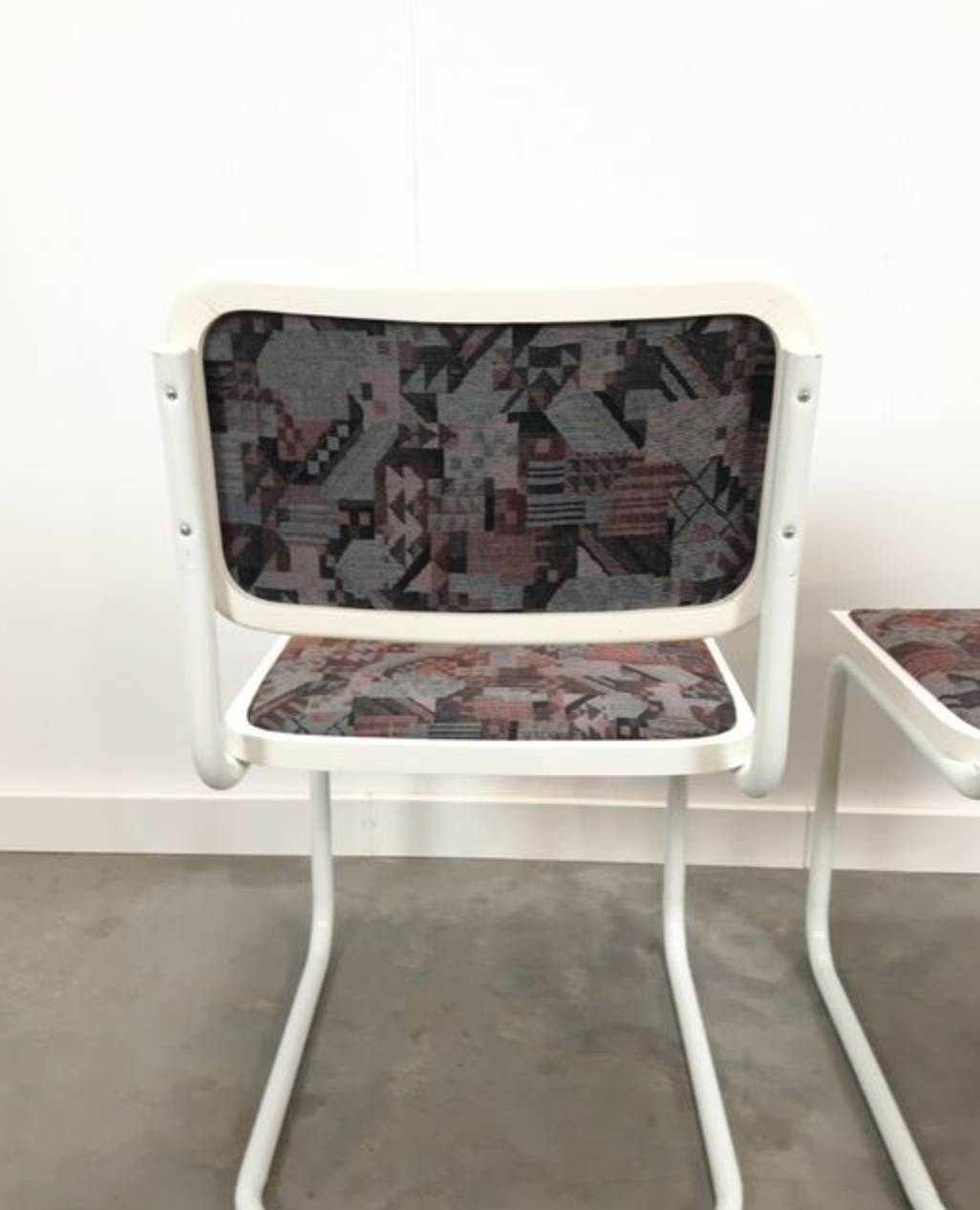 Pair of vintage tubular frame dining chairs