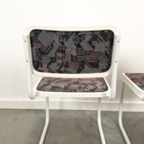 Pair of vintage tubular frame dining chairs
