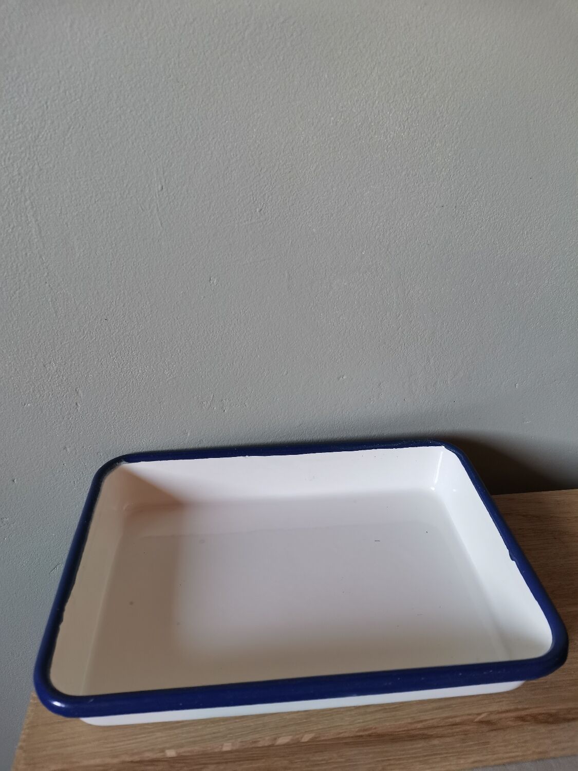 Blue and white vintage enamelled metal dish