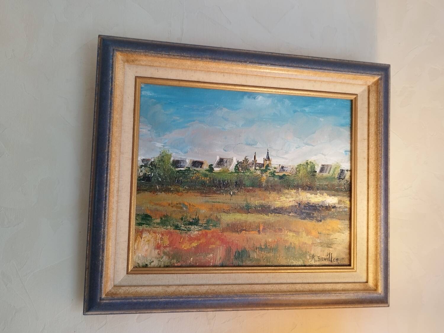 Oil on canvas "a Village in Brittany" signed by Raymond Scuiller