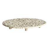 Cream perforated ceramic trivet