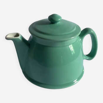 Old green ceramic teapot