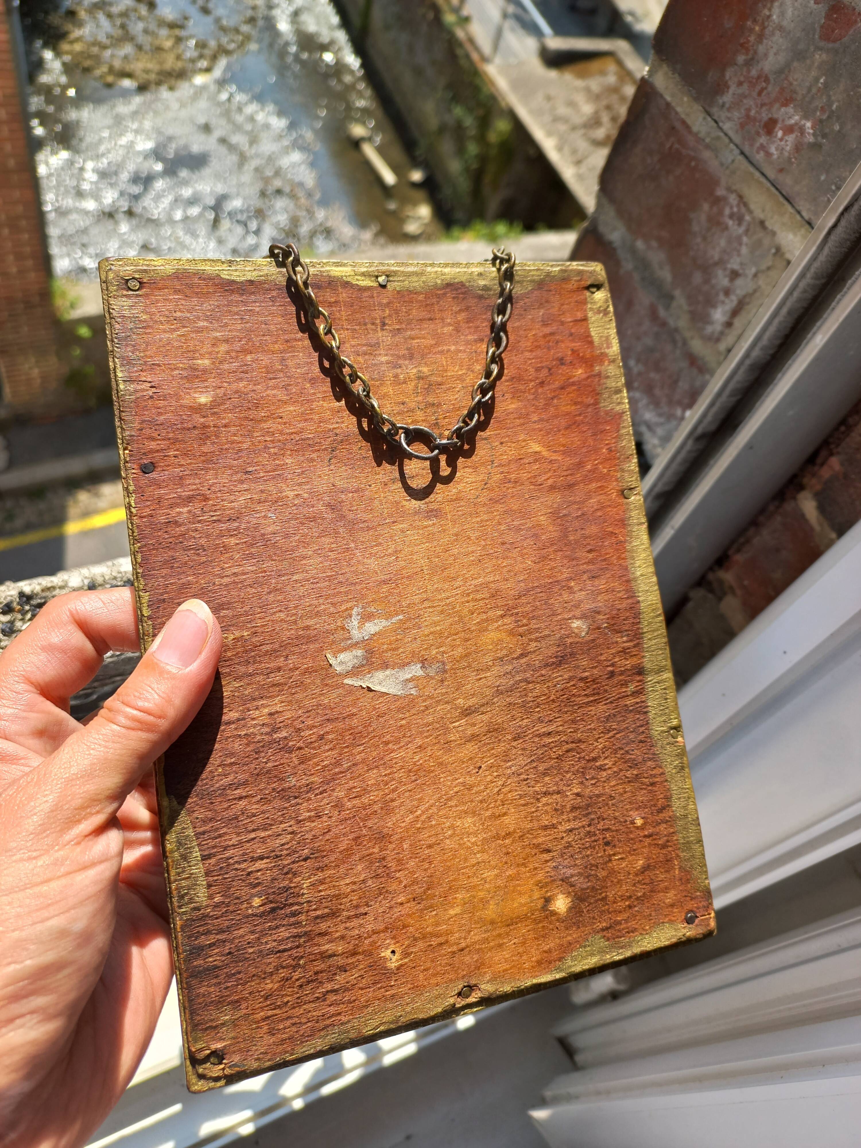 Small vintage mirror in gilded wood, bevelled glass with chain.
