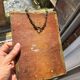 Small vintage mirror in gilded wood, bevelled glass with chain.
