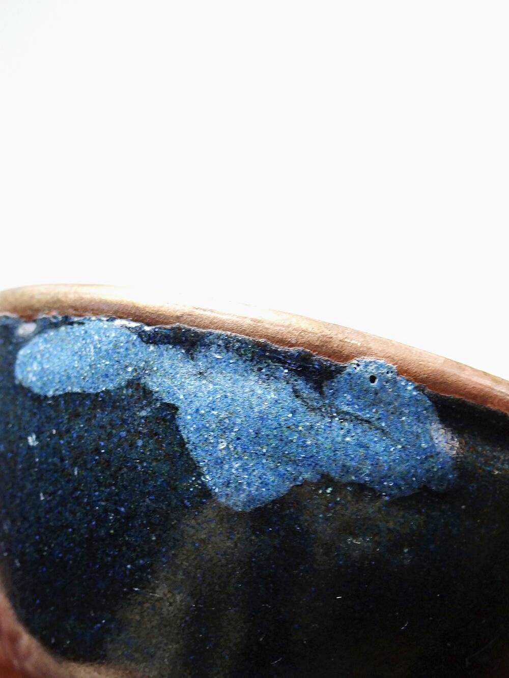 Pair of vintage hand-crafted blue and copper enamelled bowls.