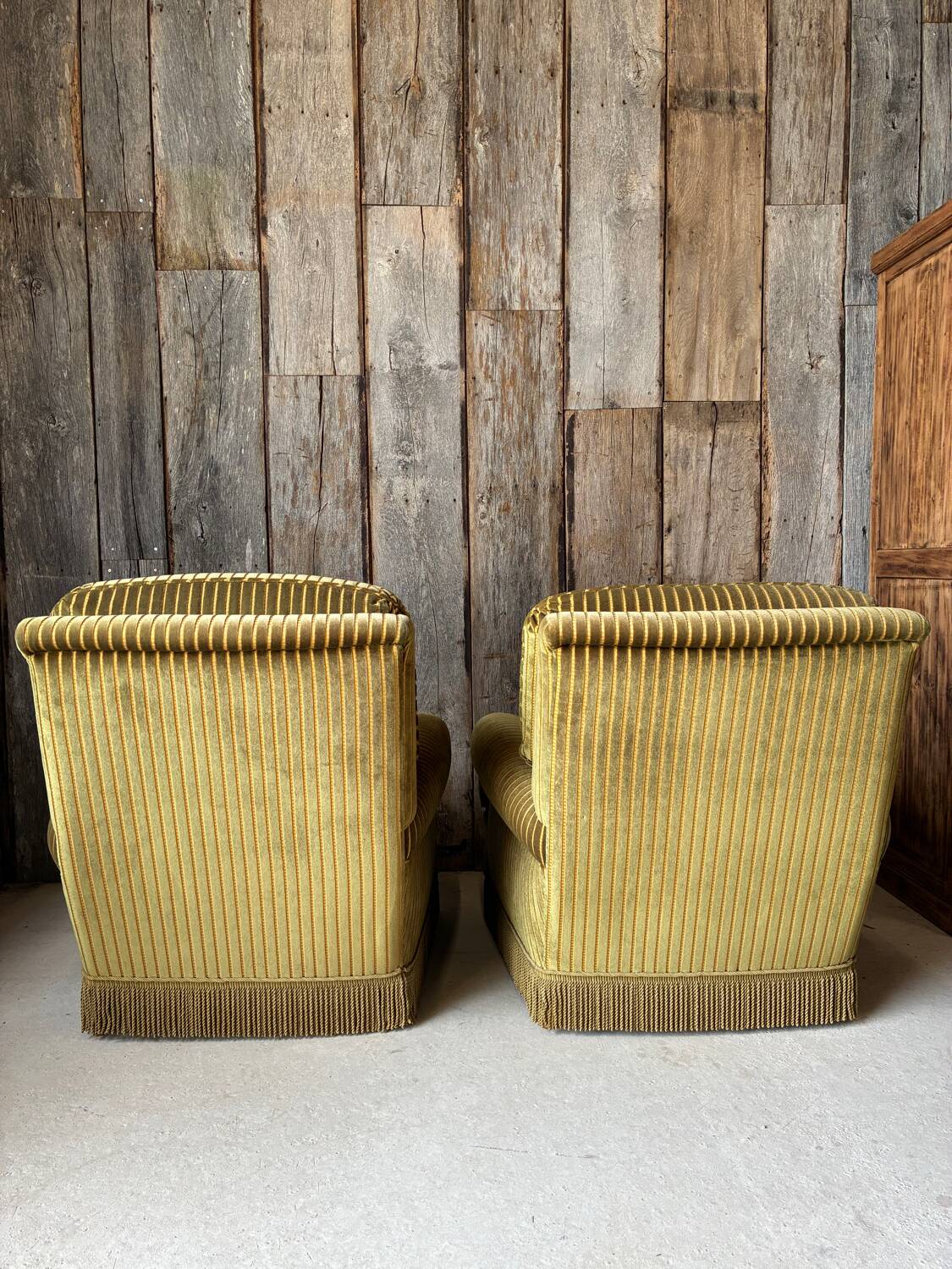 Pair of green recliner chairs