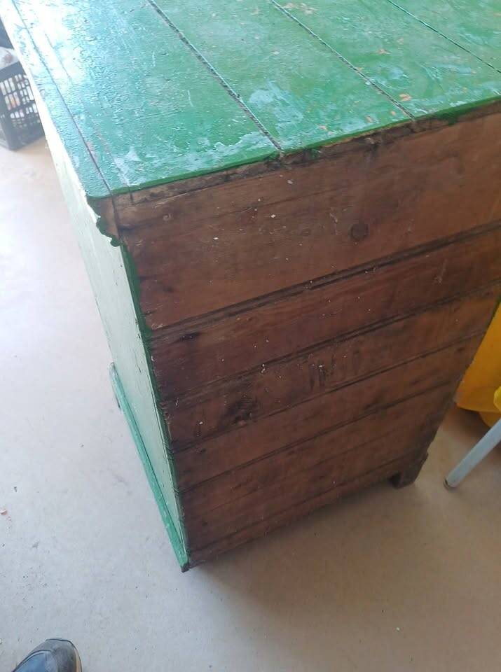 Vintage workshop furniture with 6 green drawers.