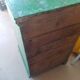 Vintage workshop furniture with 6 green drawers.