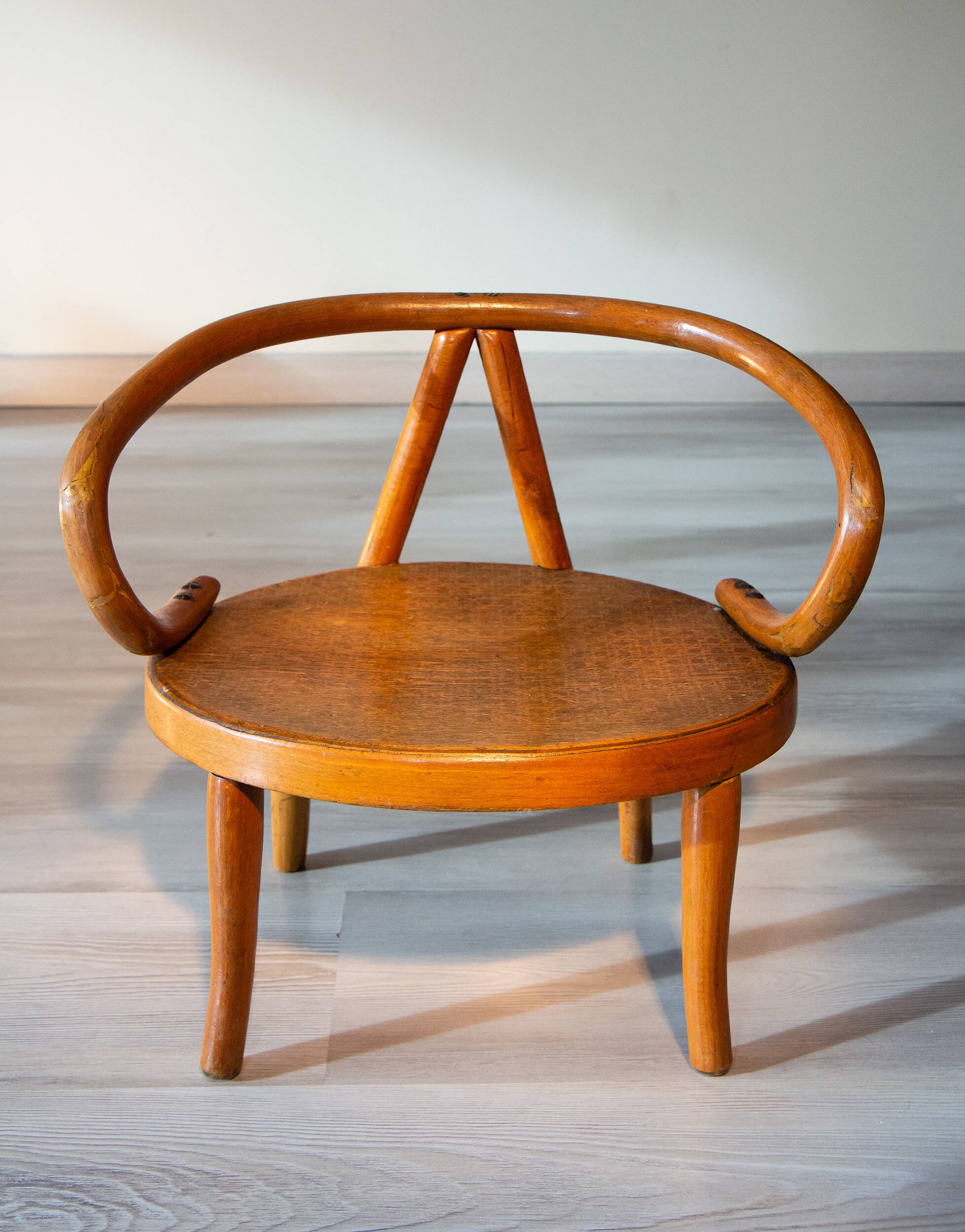 Le Corbusier style curved wood children's armchair, early 20th century