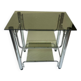 Smoked glass and chrome metal table with casters