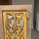 Rectangular Indonesian construction element with blue and yellow plant in carved wood