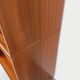 Vintage wooden bookshelf in teak style from the 1960s.