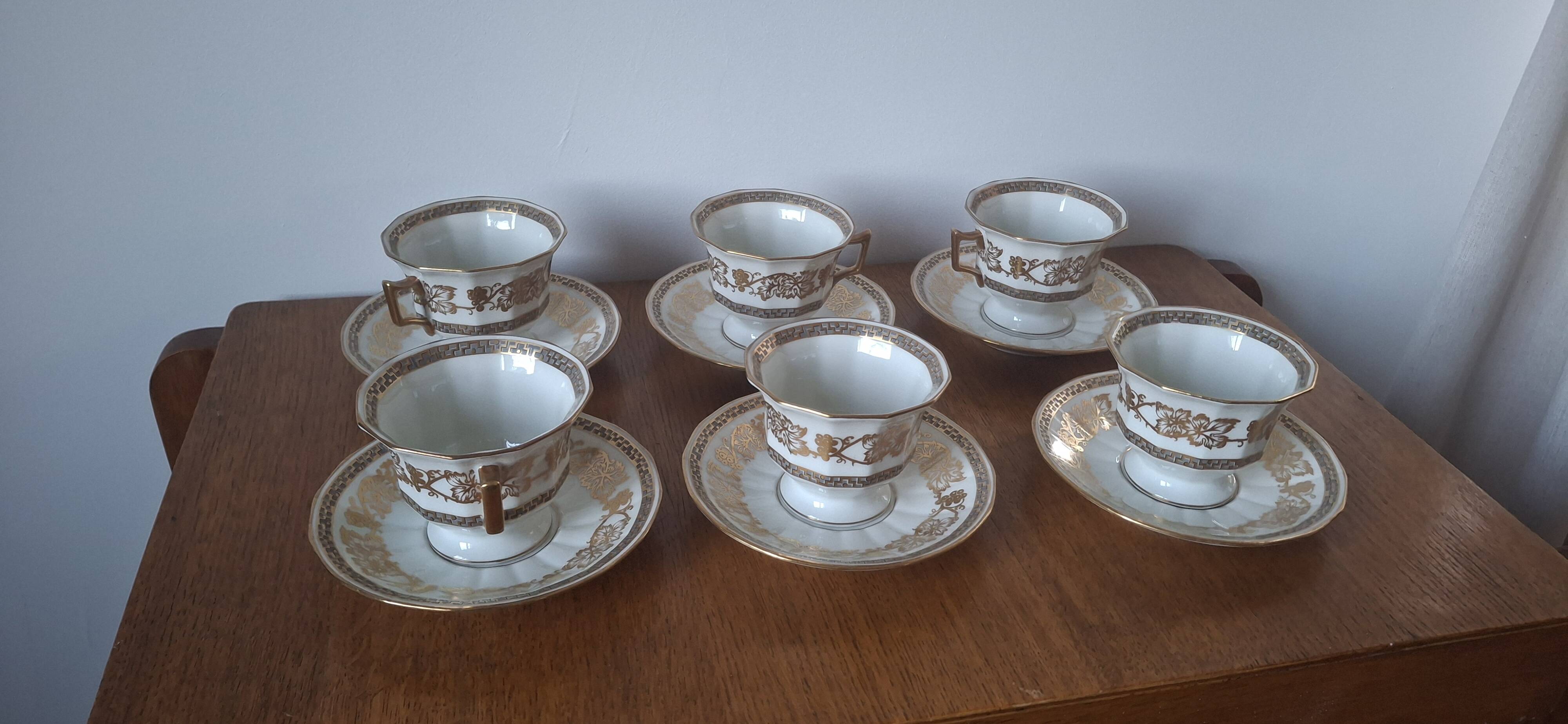 Set of 11 cups and saucers