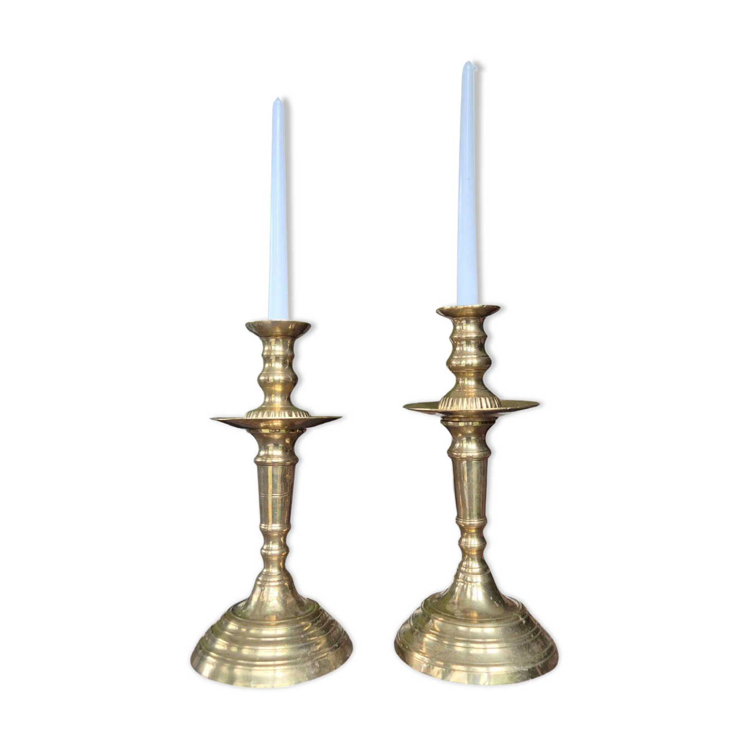 Pair of antique Moroccan brass candlesticks.