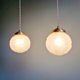 Pair of Art Deco pendant lights in transparent satin glass, 1920s-30s