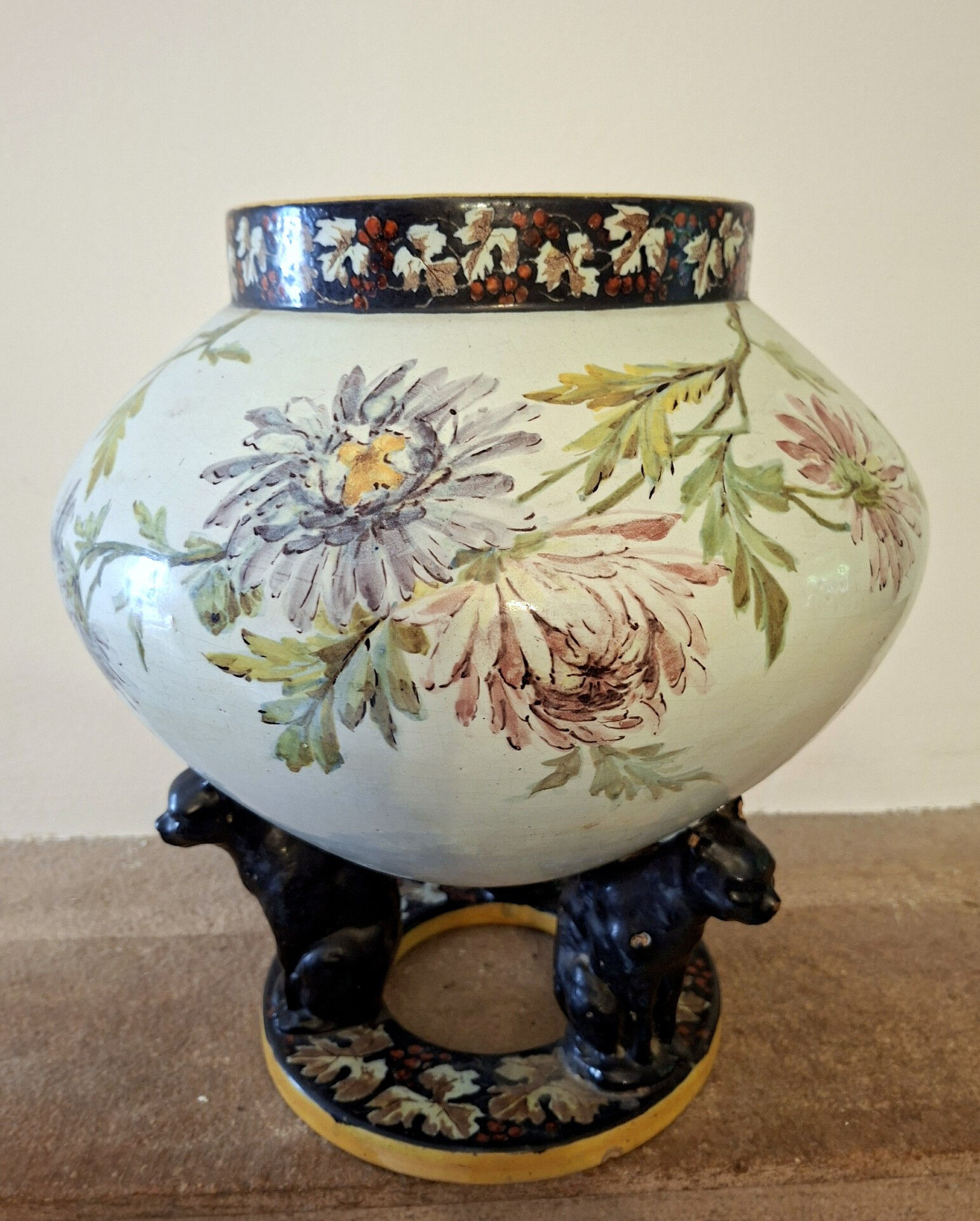 Large polychrome ceramic cache-pot with floral decoration.