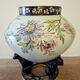 Large polychrome ceramic cache-pot with floral decoration.