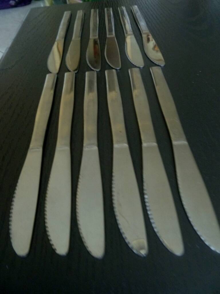 Set of 12 UTA stainless steel knives, vintage