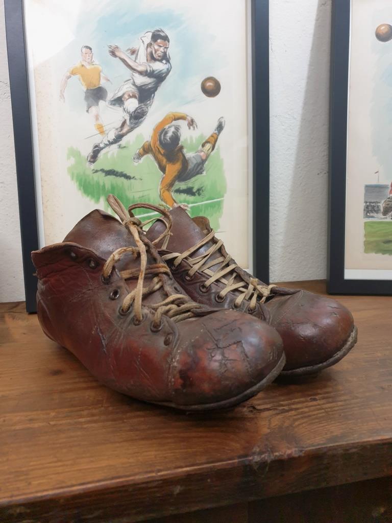 Pair of old football boots, vintage sport
