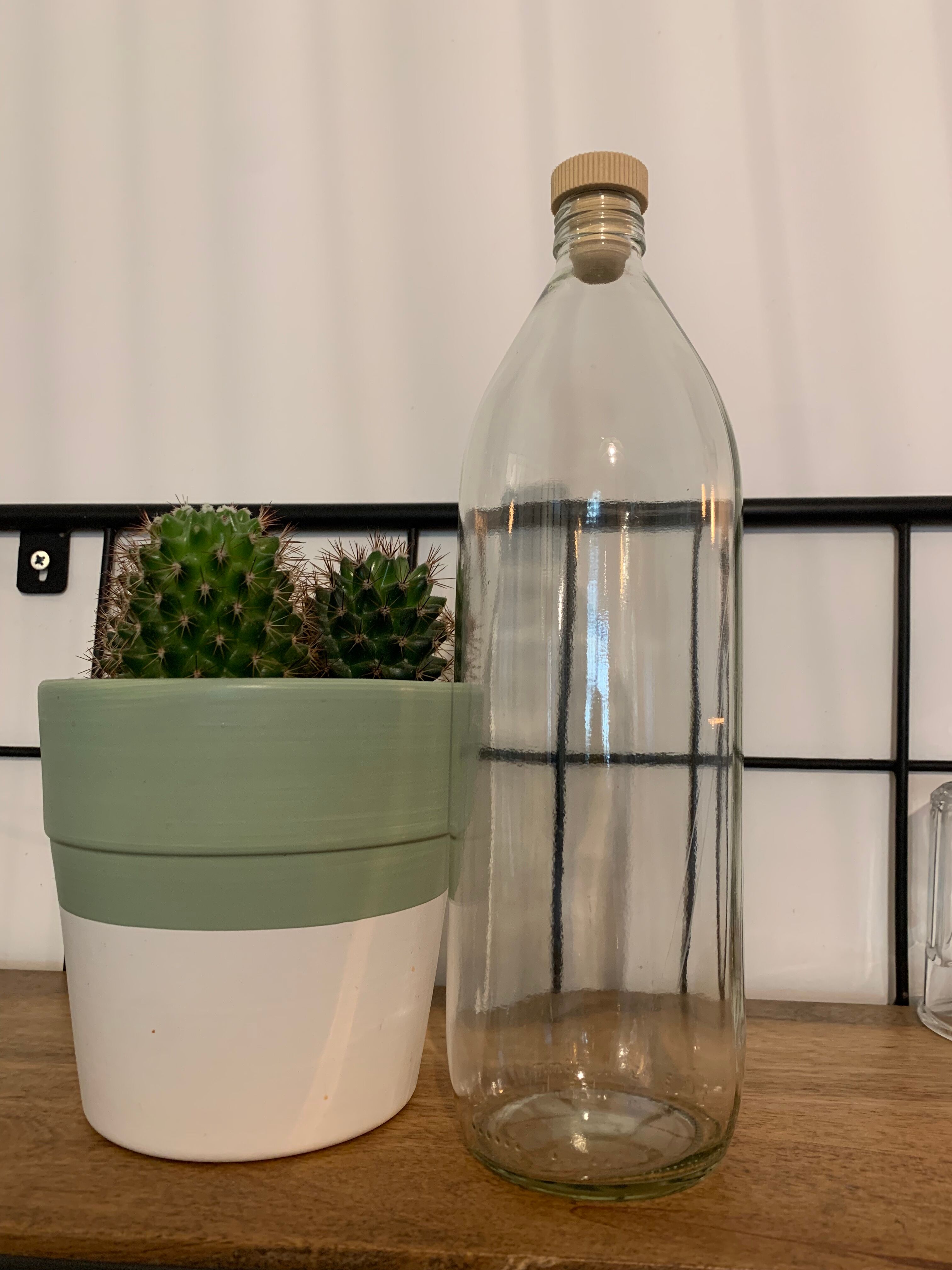 Antique glass bottle with a capacity of 1 litre and its beige cap - in very good condition!