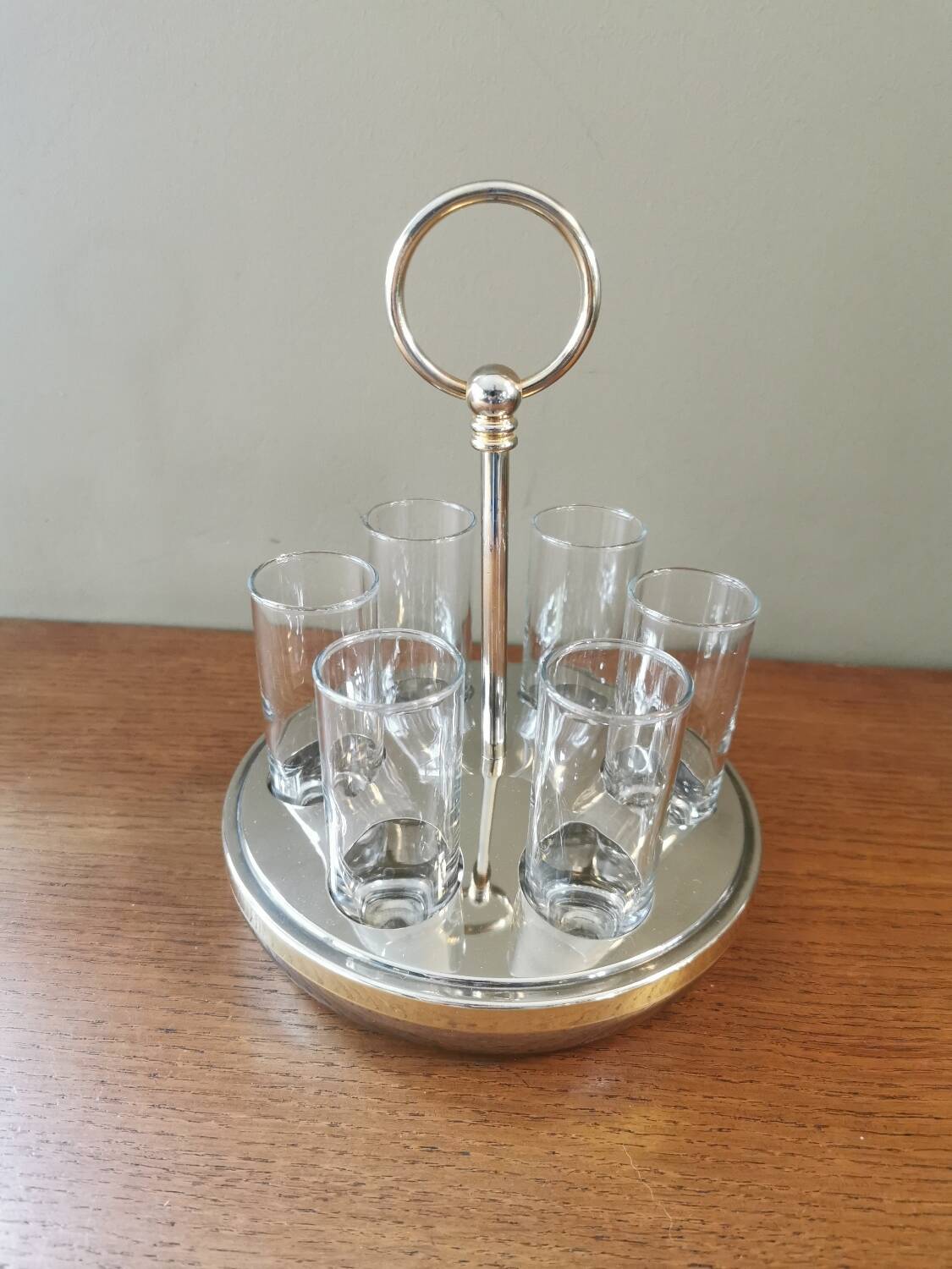 6 shot glasses on vintage metal support