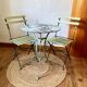 Ensemble bistrot ancien en fer forgé, table années 30 et chaises pliantes