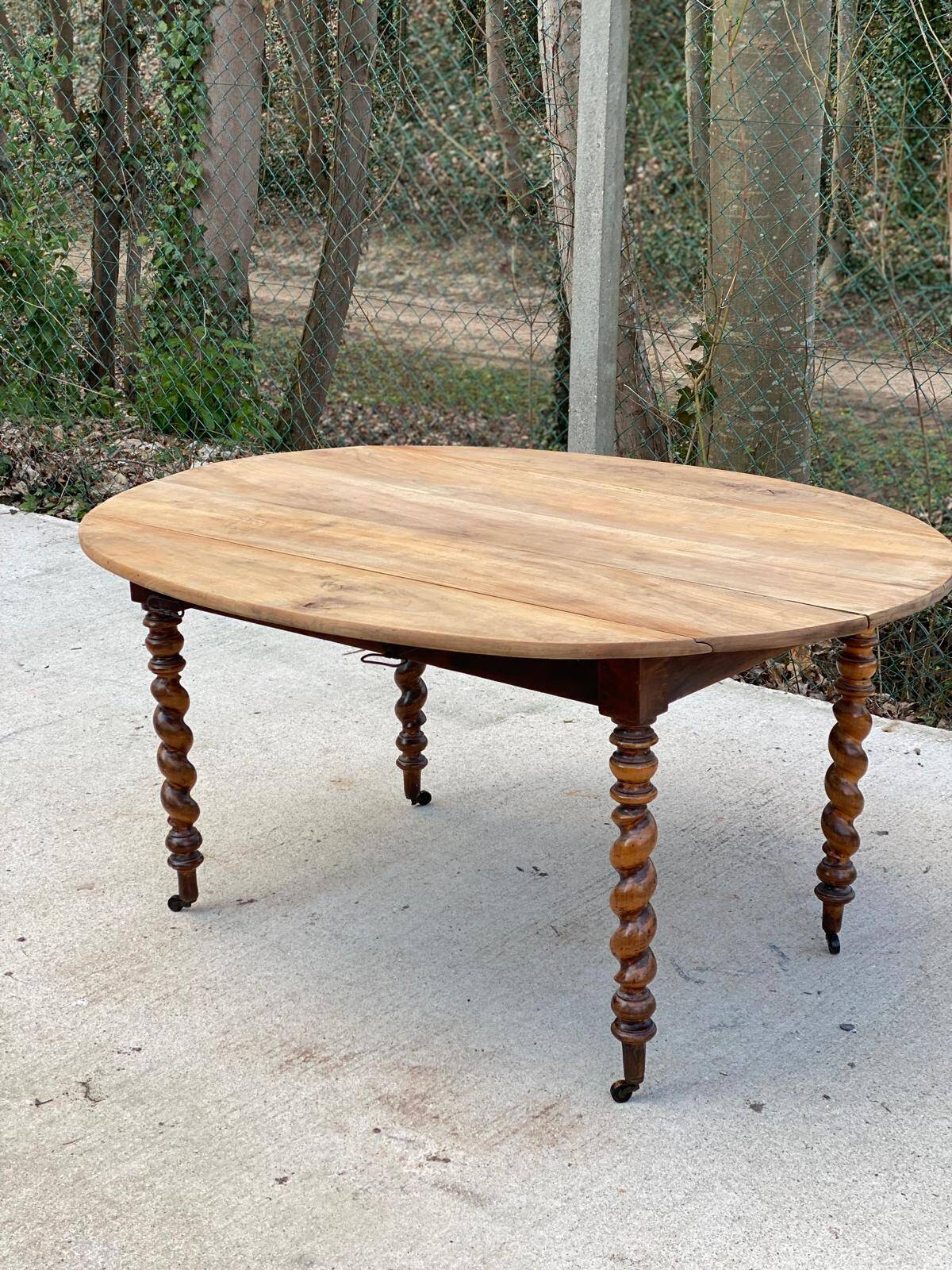 Louis Philippe oval table with shutters, 19th century, solid oak wood, twisted leg