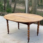 Louis Philippe oval table with shutters, 19th century, solid oak wood, twisted leg