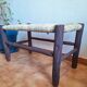 Moroccan bench in dark wood with woven palm leaf seat