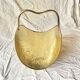 Vintage hammered brass log holder