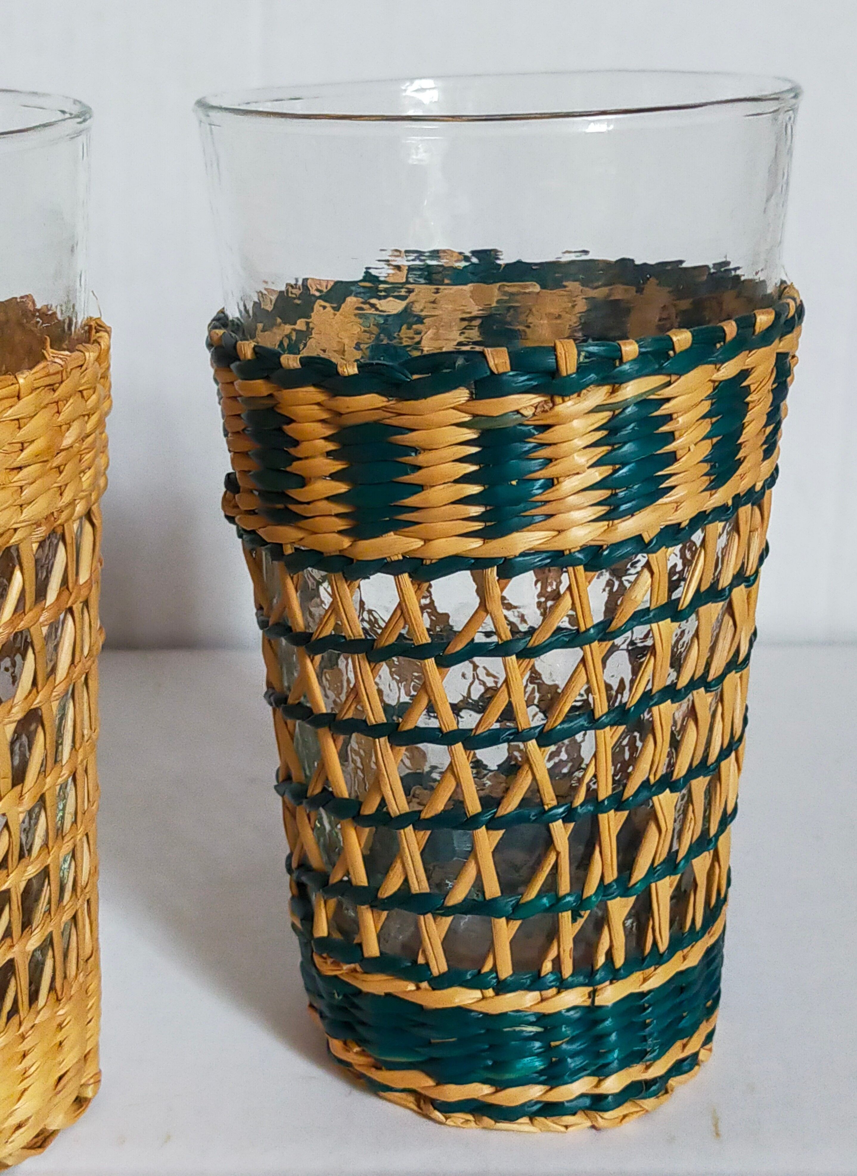 Four long drink glasses in vintage woven rattan cases