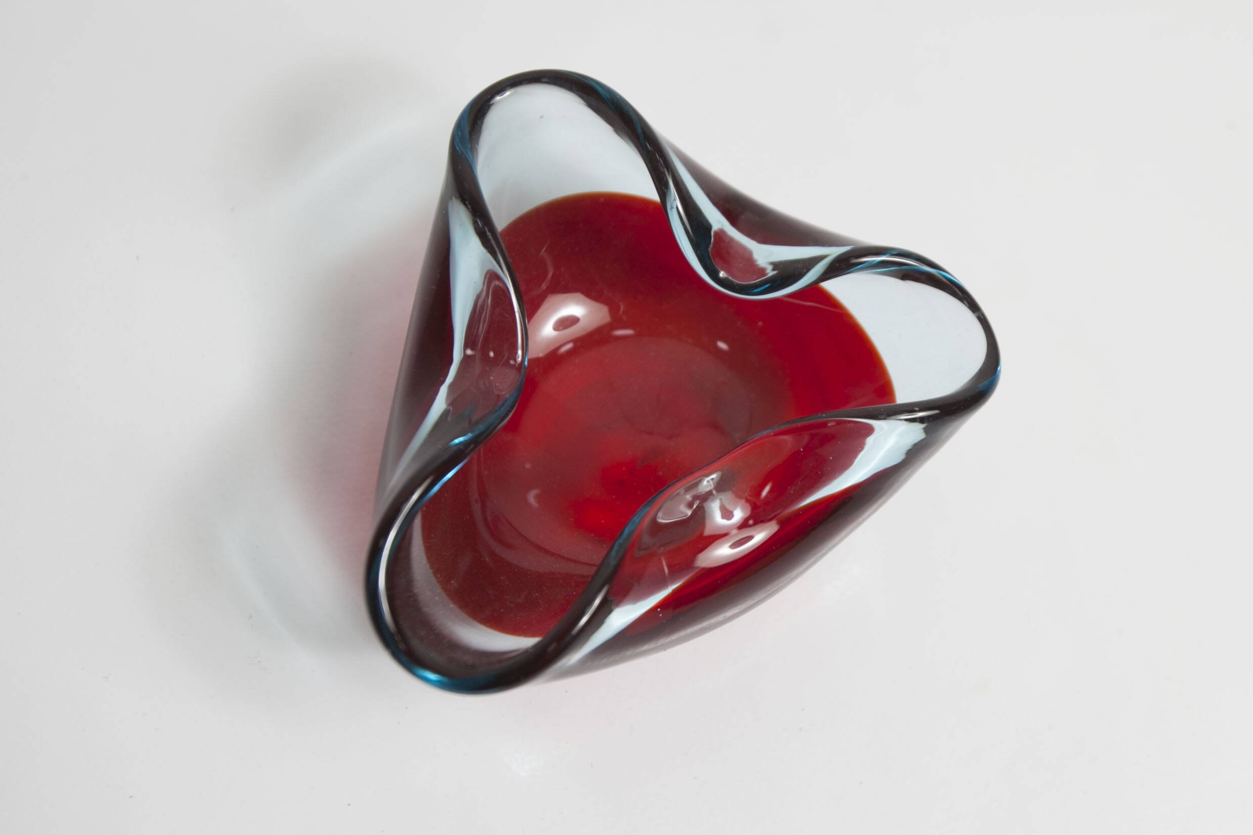 Asymmetrical ashtray murano red and transparent background 1960