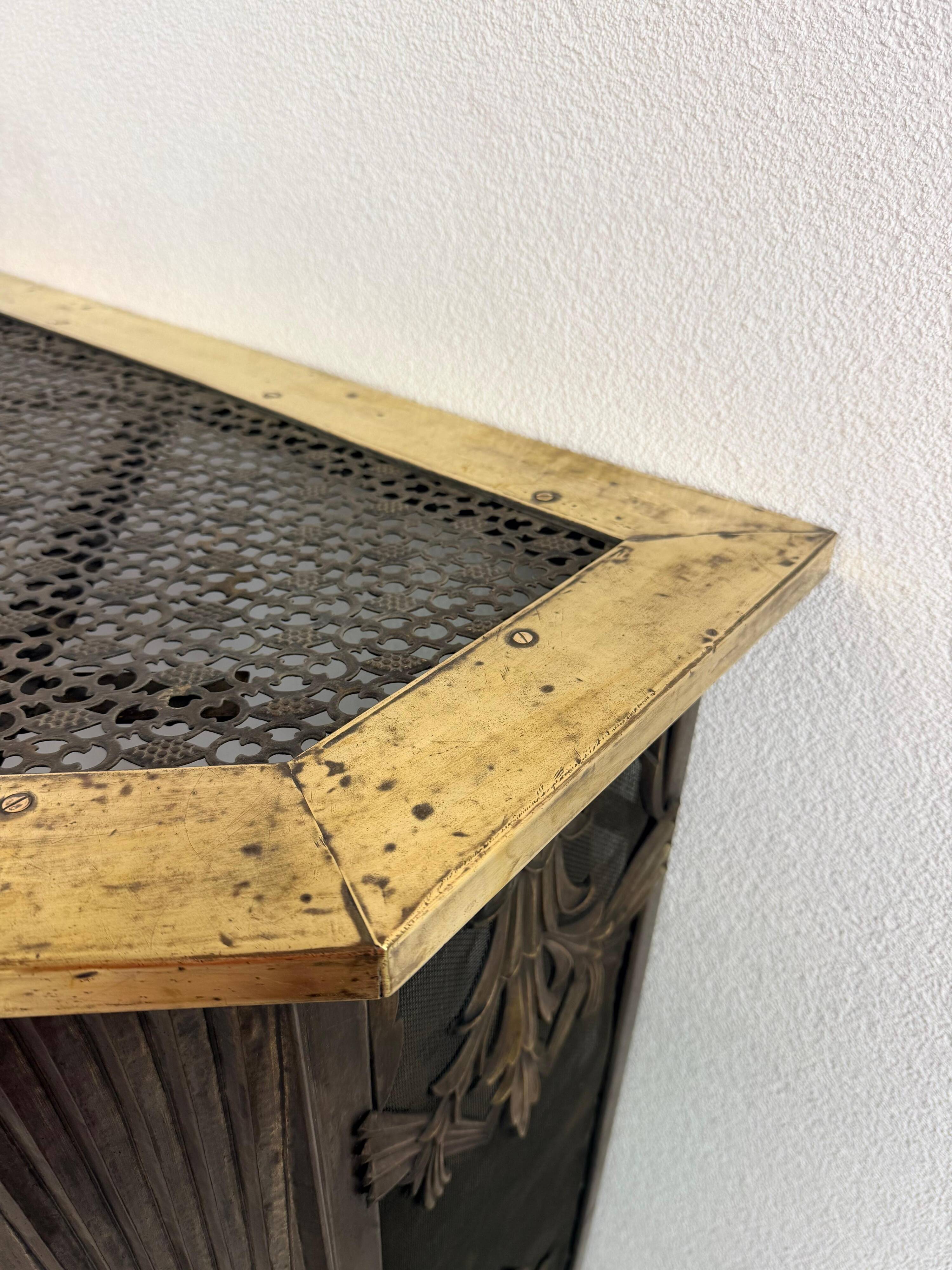Corner fireplace screen in brass attributed to Dagobert Peche