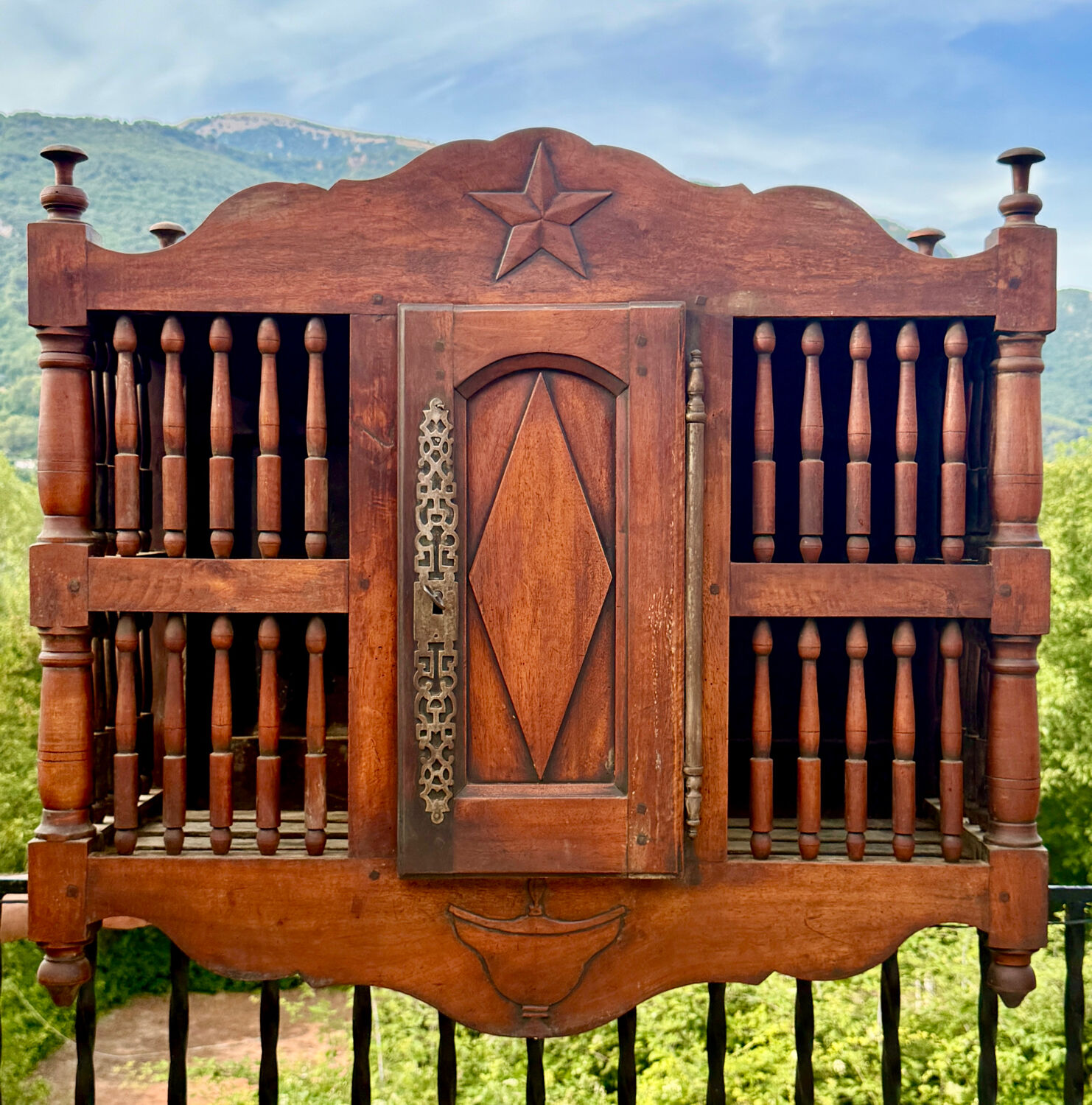 Molded and carved walnut panetière, 19th century.