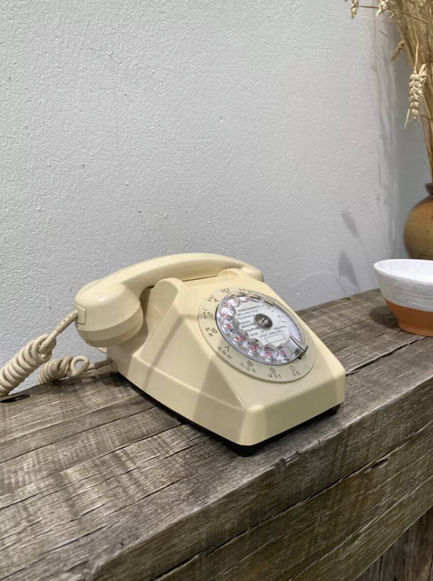Vintage beige rotary telephone