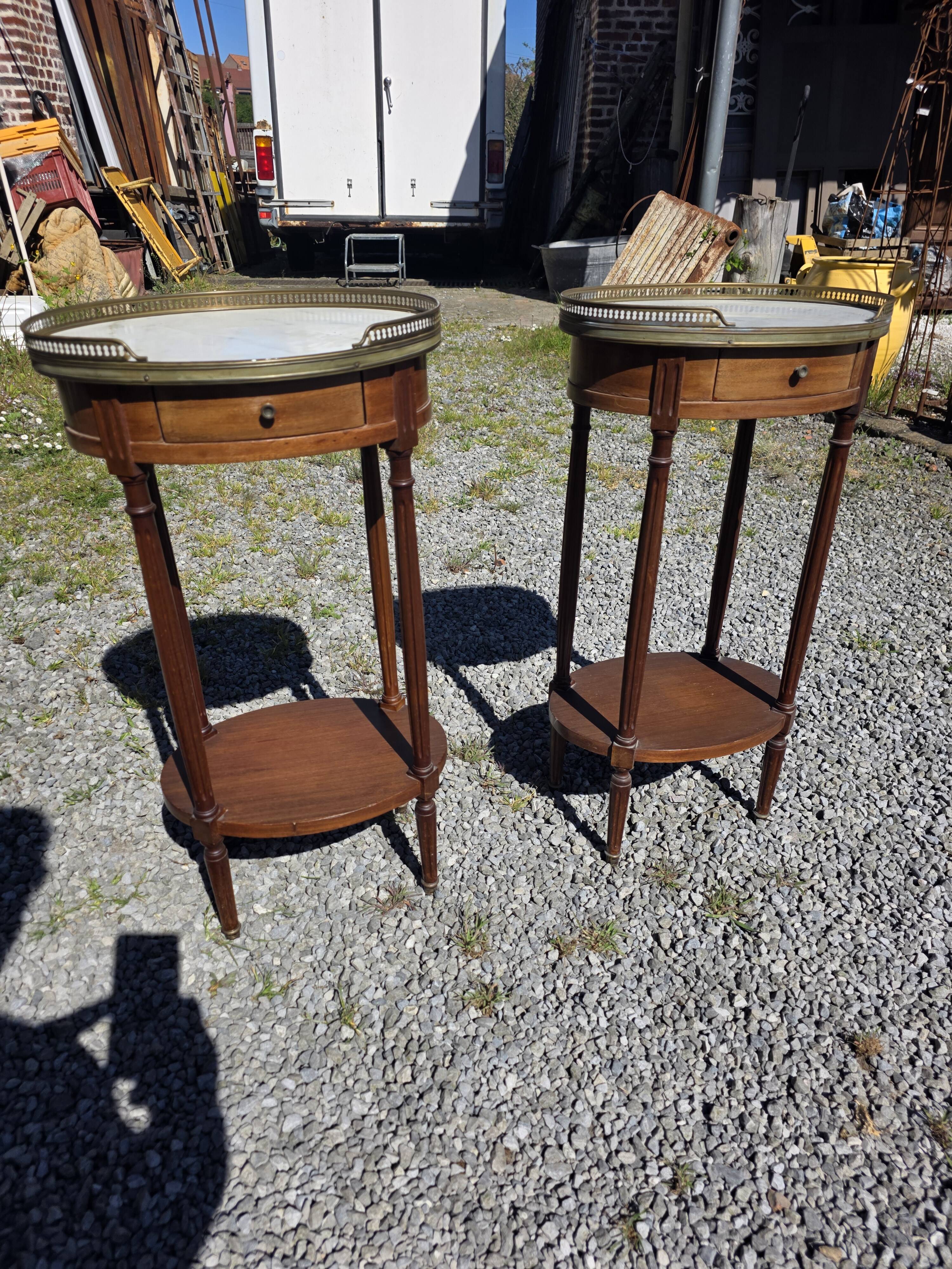 Pair of Louis XVI style bedside tables in mahogany, with marble tops.