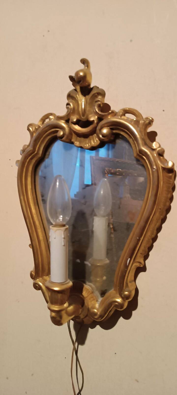 Vintage gold mirror sconces from the late 1950s.