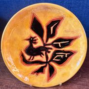 Terracotta plate, Jean Lurçat decorated with a rooster and foliage.