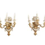 Pair of Louis XVI style wall lights in gilded and lacquered wood. Circa 1900.