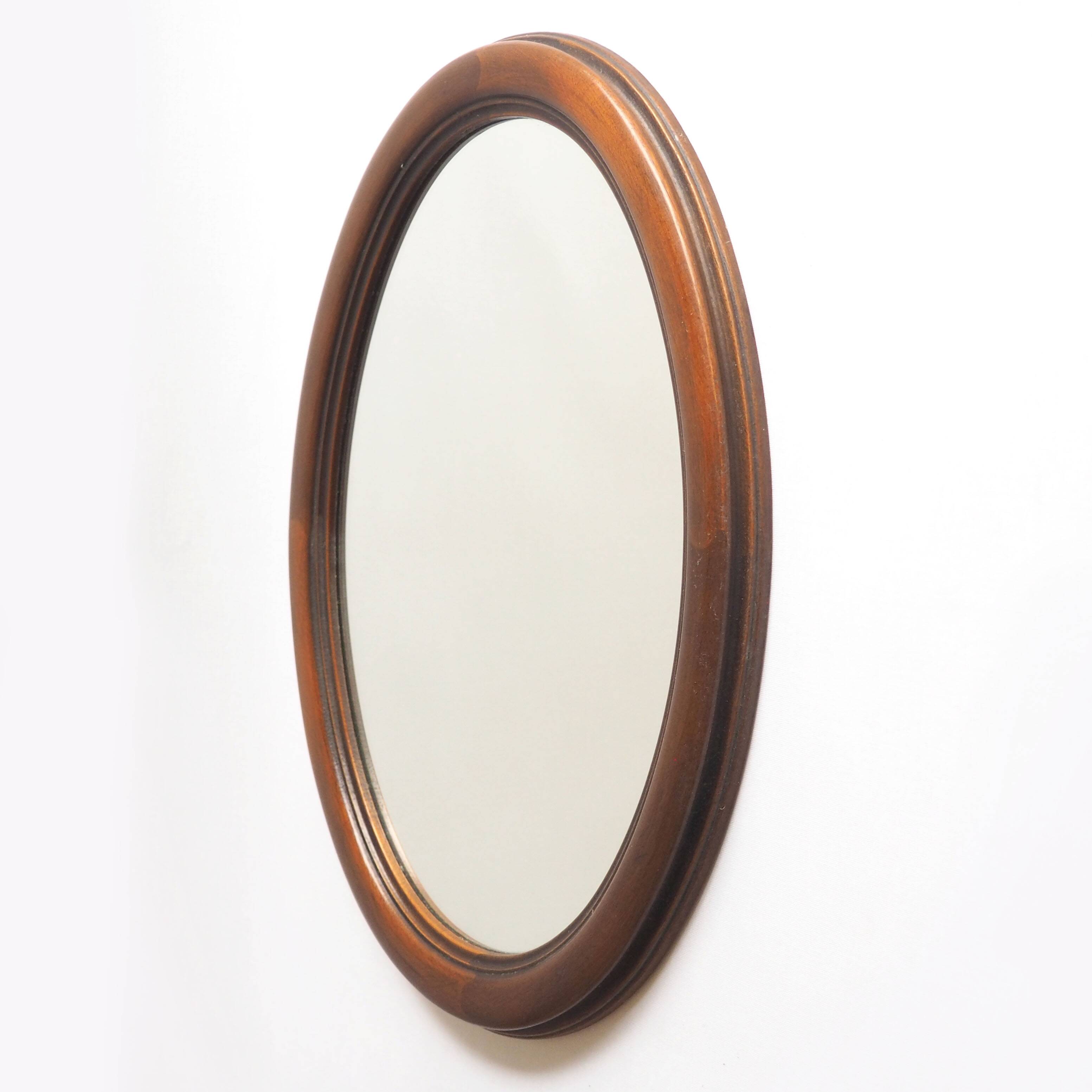 Oval mirror with wooden frame