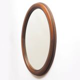 Oval mirror with wooden frame