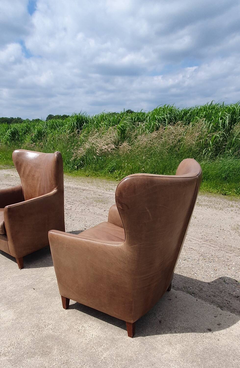 Pair leather wingback armchairs Machalke