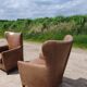 Pair leather wingback armchairs Machalke