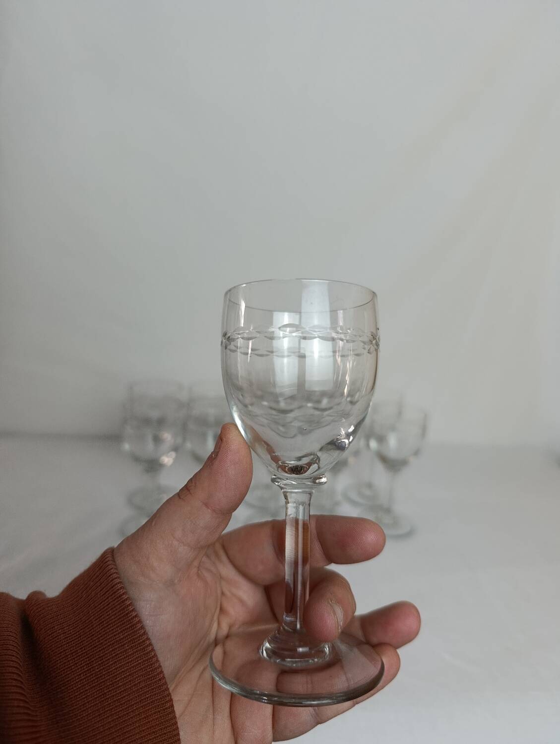 Set of 11 antique engraved crystal liqueur glasses.
