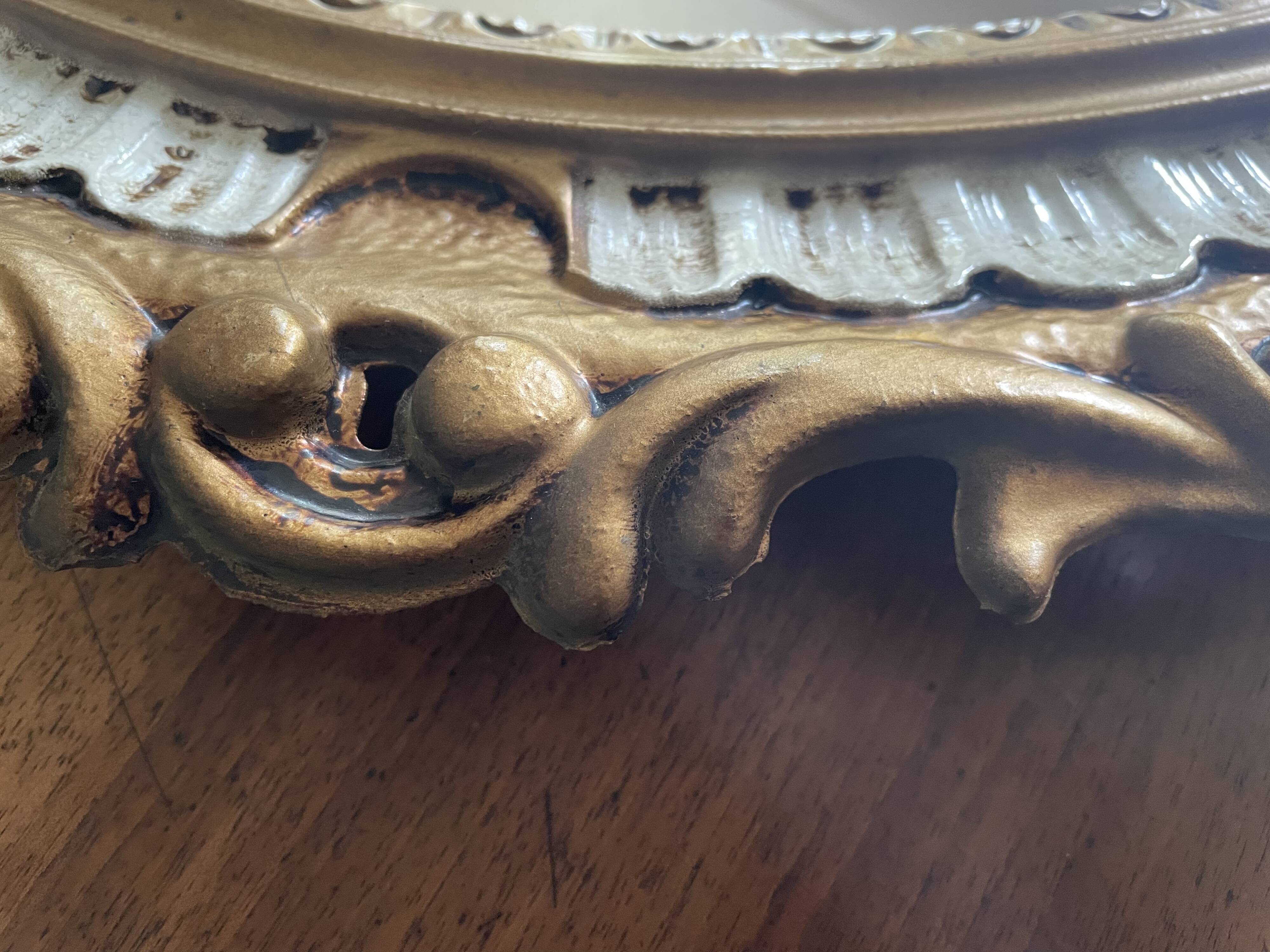 Kitsch 70s gold resin oval mirror